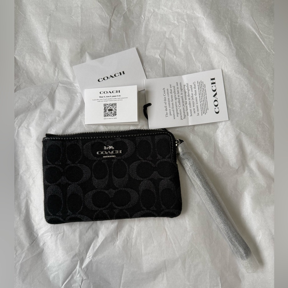 Corner Zip Wristlet
In Signature Denim